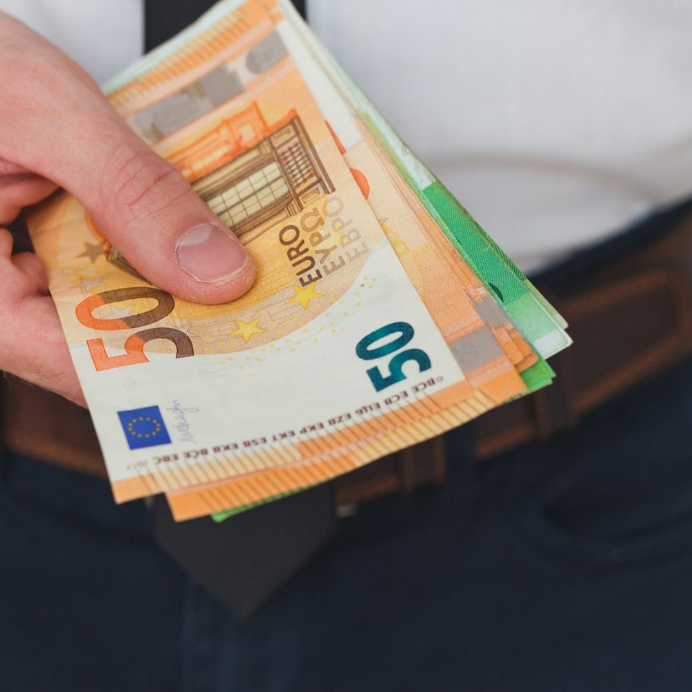 Detail of man hands with money, euro notes